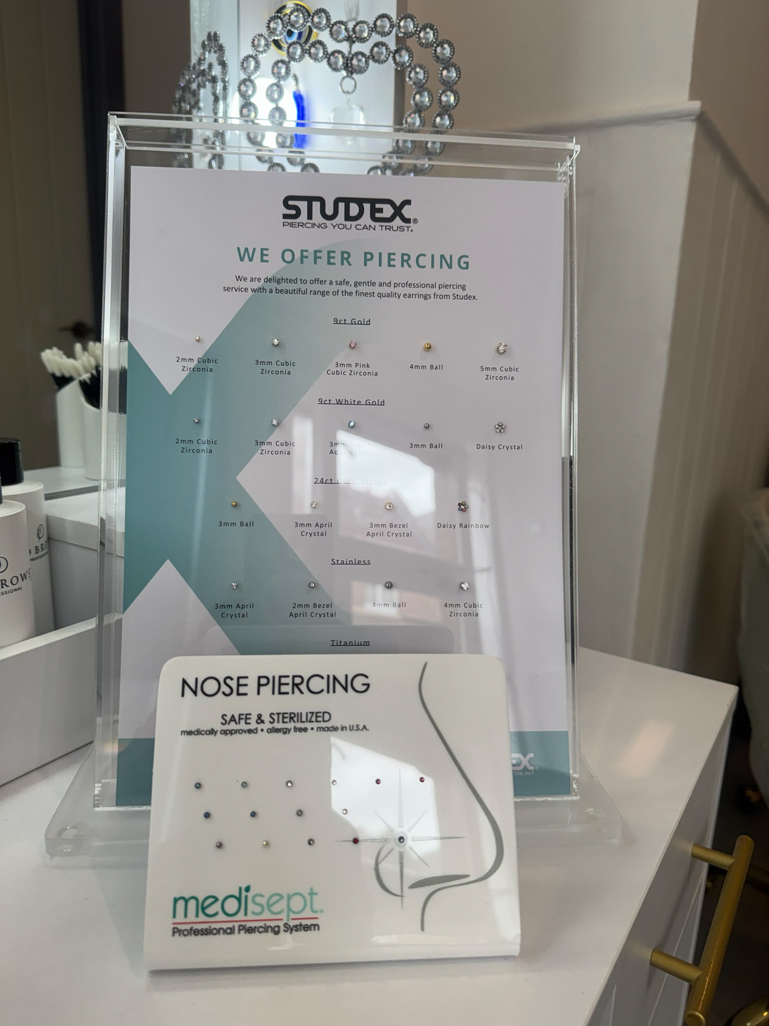 Professional Studex ear piercing jewellery and Medisept nose piercing display available at MJ Beauty & Brows in Abingdon.